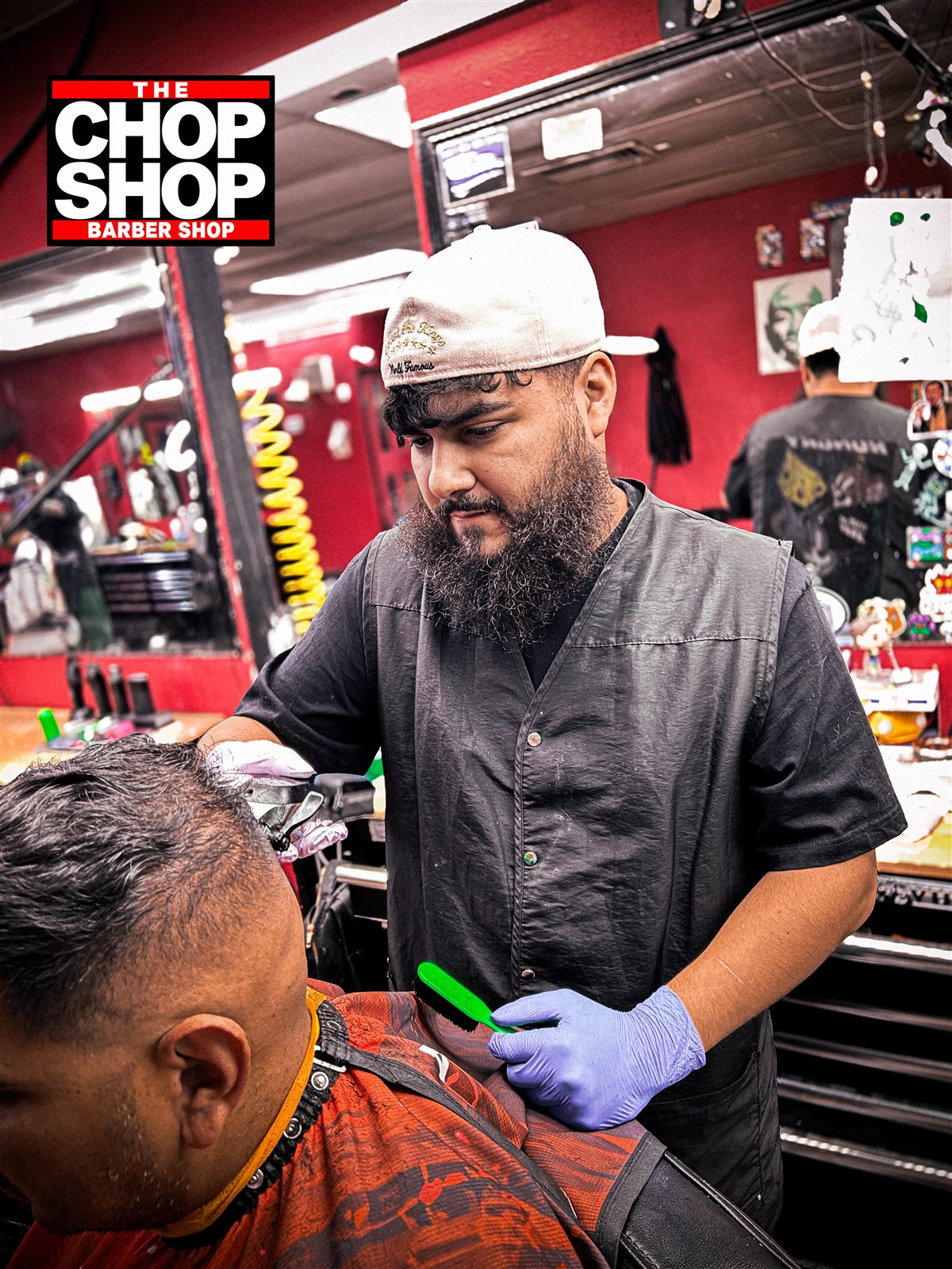 Rene cutting a client's hair